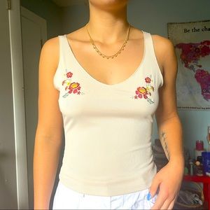 Tan tank with two flowers